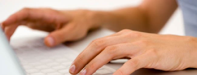 Hands at a keyboard typing