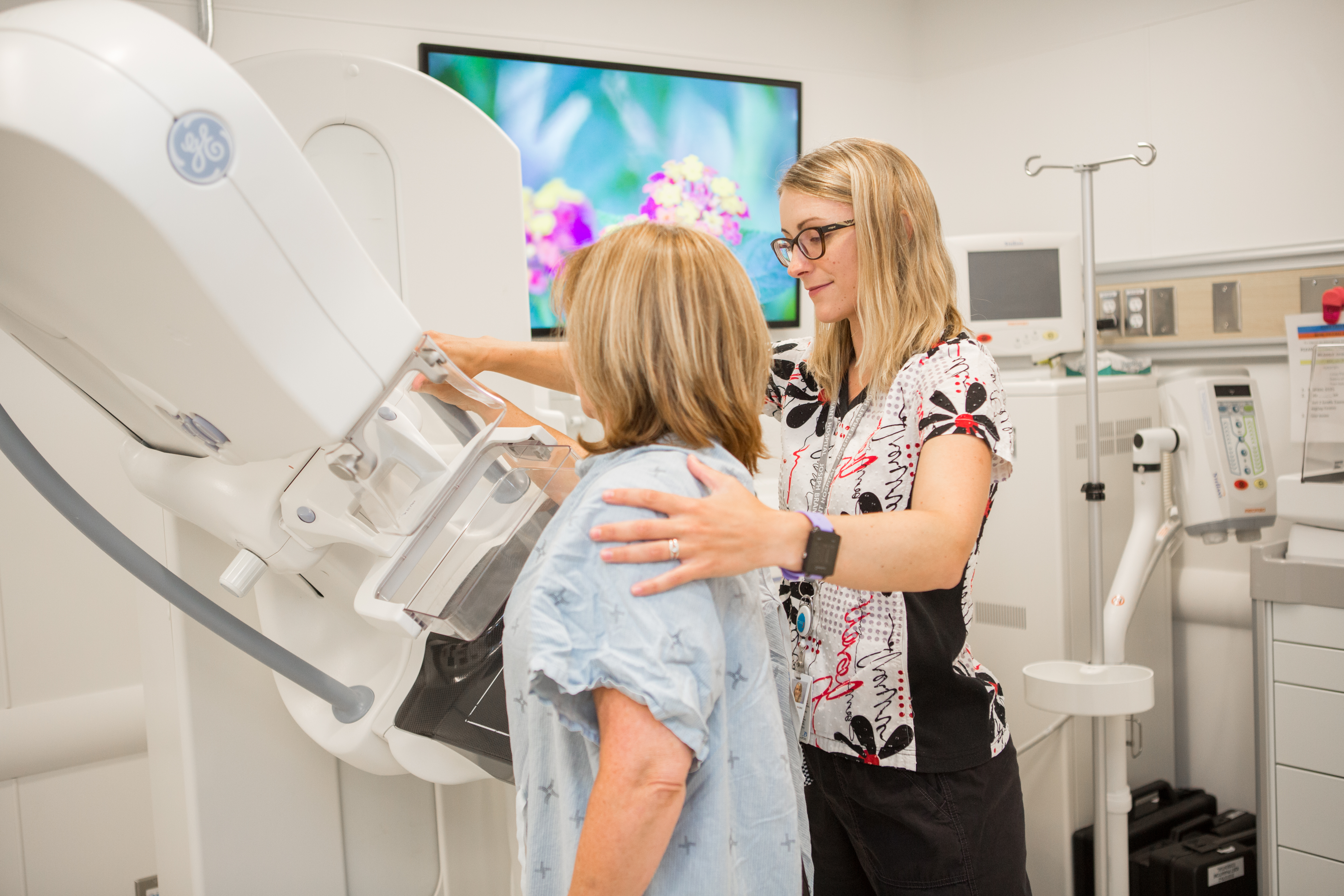 Picture of woman getting a mammogram at the new facility